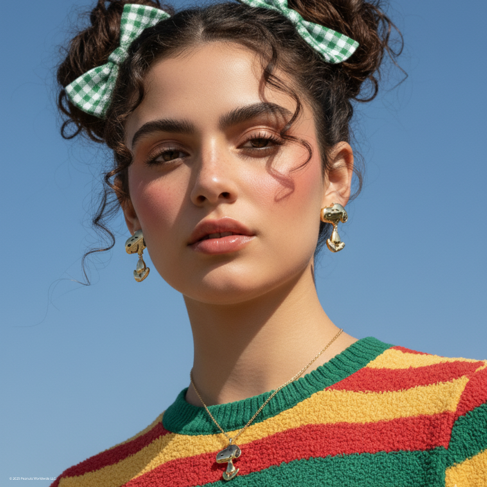 Brunette_model_wearing_gold_Peanuts_Snoopy_drop_earrings_snoopy_necklace