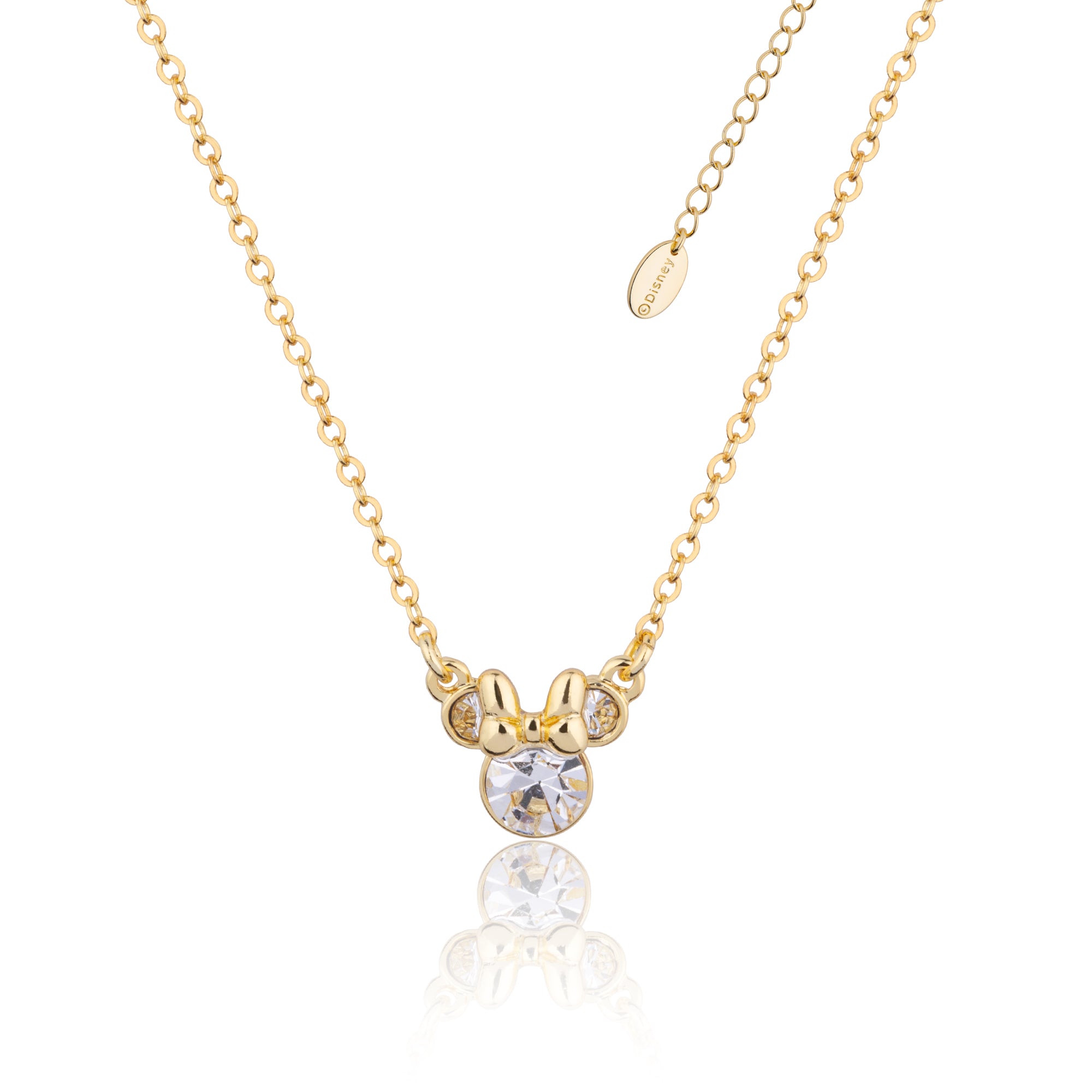 Gold necklace with a small Minnie Mouse Birthstone pendant with clear April Crystals on a white background by Couture Kingdom