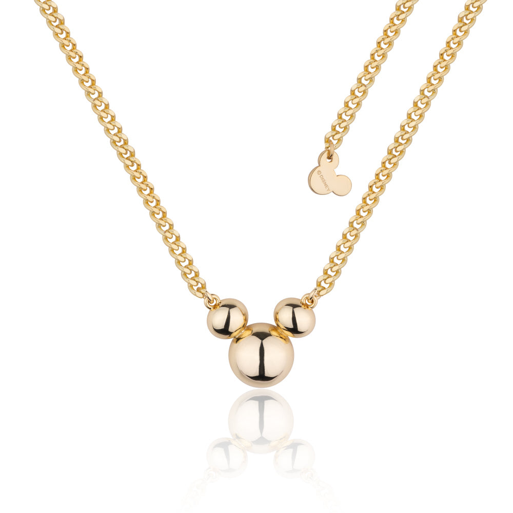Yellow gold plated mickey mouse pendant on a thicker flat curb chain by couture kingdom on a white background