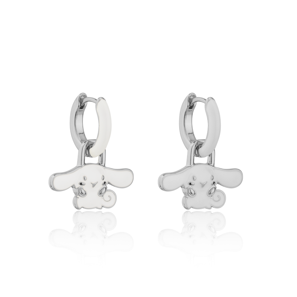 Pair of white gold hoop earrings with white enamel and a small Sanrio Hello Kitty Cinnamoroll charm on a white background