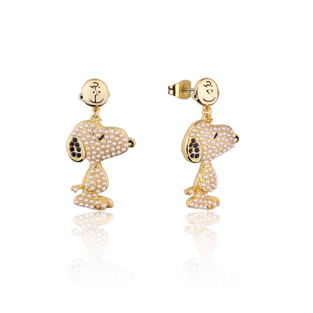 Gold Snoopy shaped earrings with black accents and mini pearls on a white background