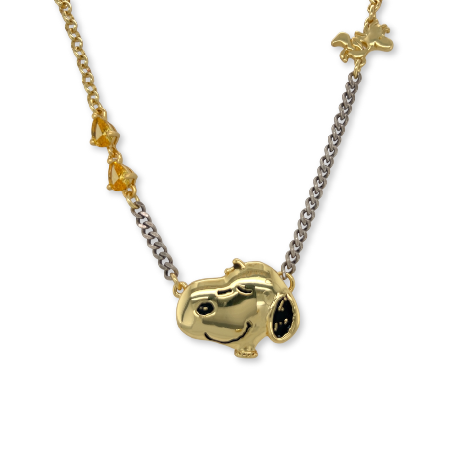 Gold and silver necklace with a Snoopy pendant on a white background