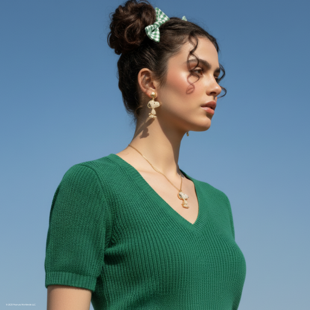 Brunette_model_wearing_Peanuts_Snoopy_mini_pearl_drop_earrings_featuring_charlie_brown_and_snoopy_necklace_