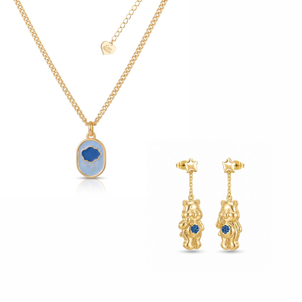 Silver Grumpy Bear Care Bears necklace and drop earrings with blue crystals set on a white background by Couture Kingdom