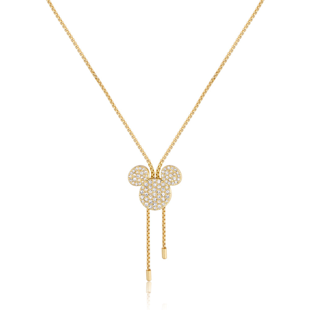 Gold necklace with a pendant shaped as Mickey Mouse with clear crystals, on a white background