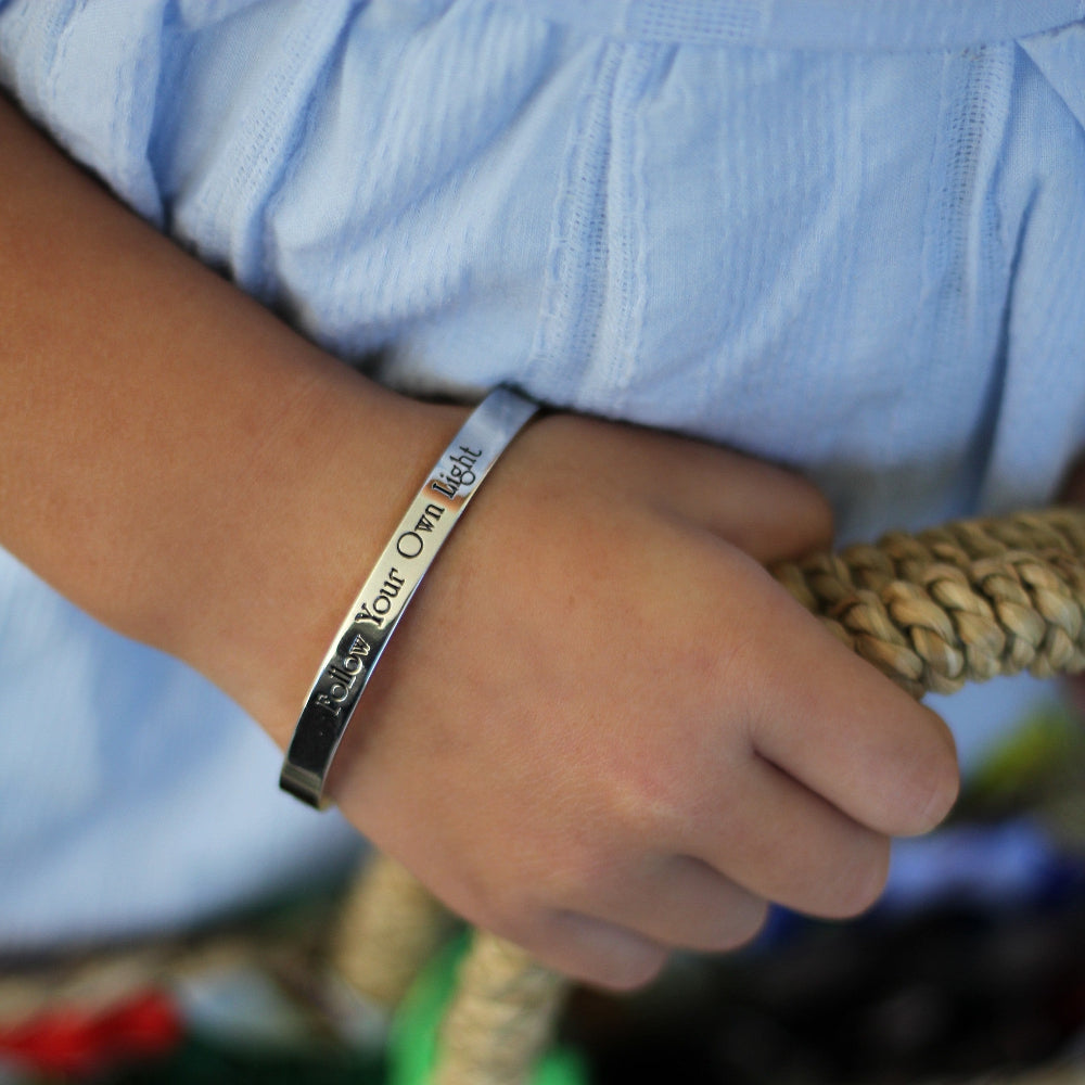 Disney Princess bangle with quote follow your own light by Couture Kingdom worn on model 