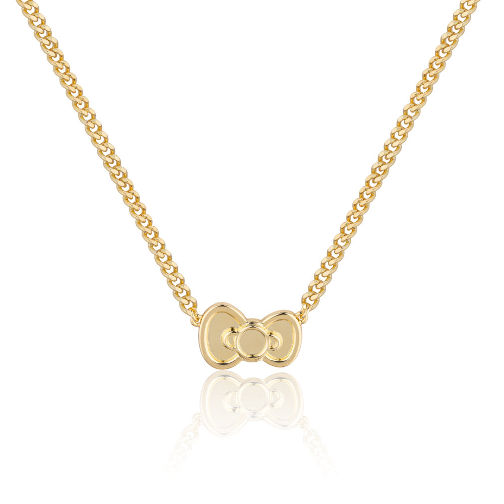 Gold necklace with a Sanrio Hello Kitty bow pendant on a white background