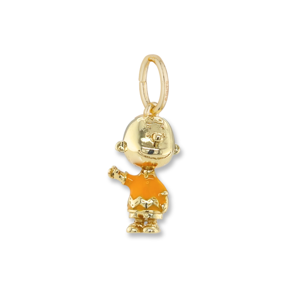Gold Charlie Brown charm on a white background