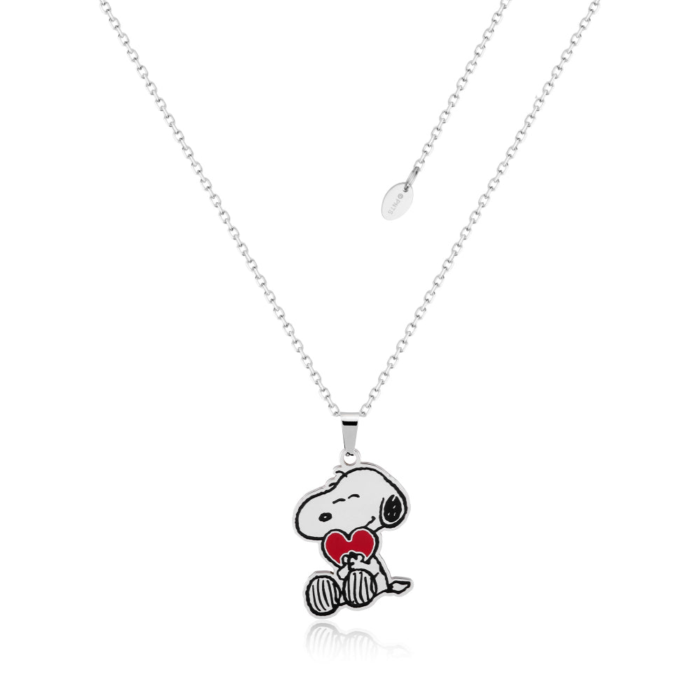 Stainless Steel Necklace with Peanuts  Snoopy holding a red enamel heart pendant on a white background