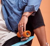 Streets_Bubble_OBill_Jewellery_on_Model_with_Skateboard