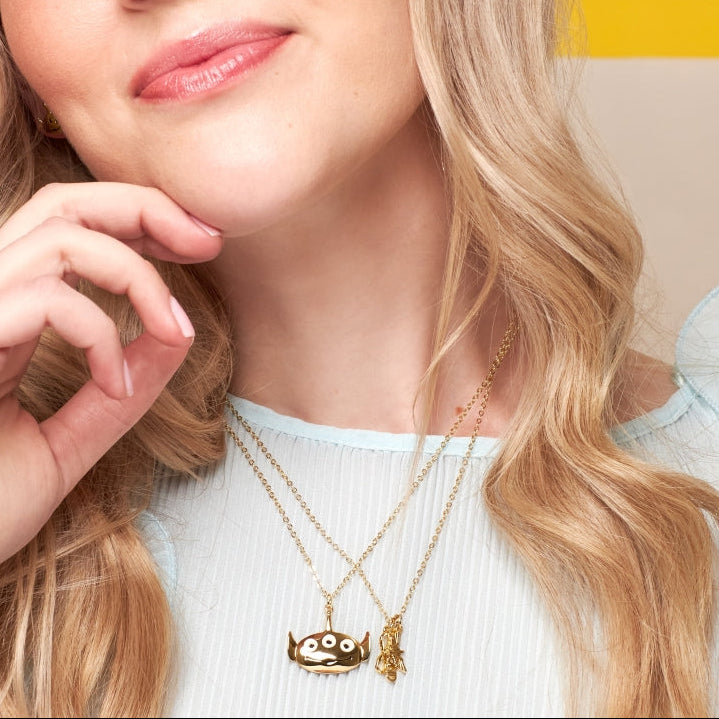 Yellow Gold Disney Pixar Toy Story Alien necklace by Couture Kingdom worn on model with neutral background